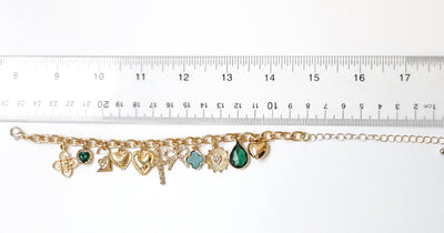 Chunky Charm Bracelet with Cross, Bow, Clover and Stones
